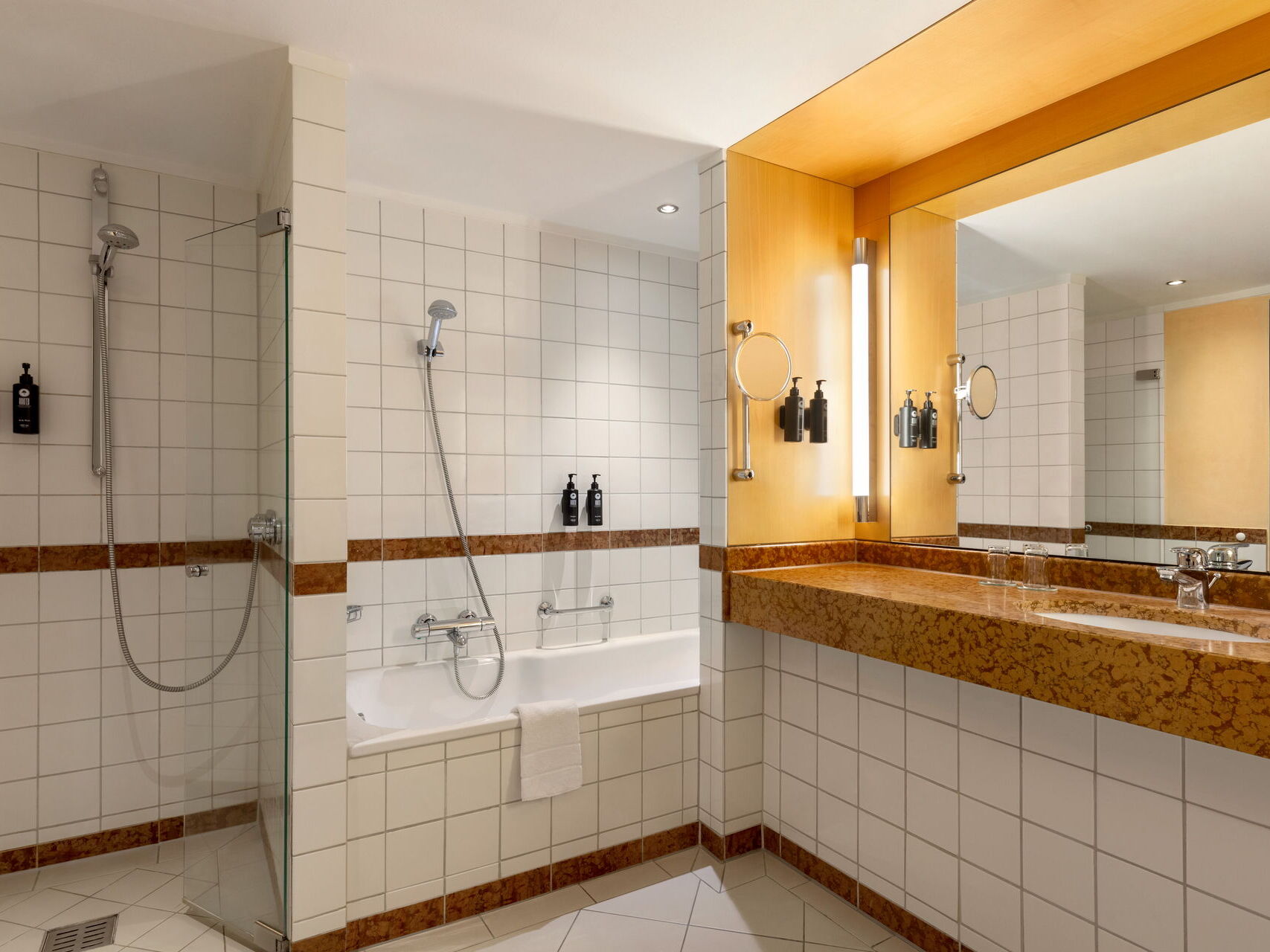 Bathroom with shower, bathtub, sink, and mirror
